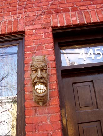 Gargoyle guards door on le Plateau, Montreal